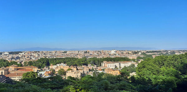 View of townscape against blue sky