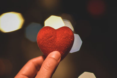 Close-up of hand holding heart shape