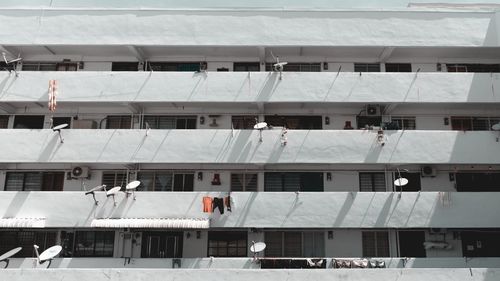 Low angle view of people working on building