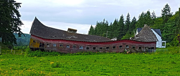 Built structure on landscape against sky