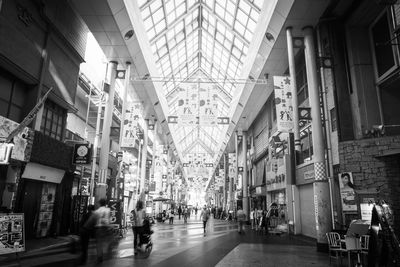 Group of people walking in shopping mall