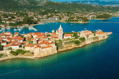 High angle view of townscape by sea