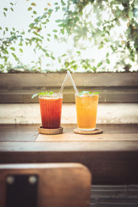 Summer drink with ice put on wood table in vintage coffee shop