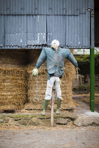 Full length of scarecrow in a barn on a farm