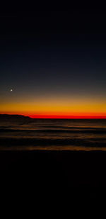 Scenic view of sea against sky at sunset