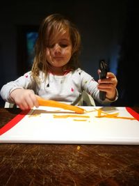 Happy girl holding table