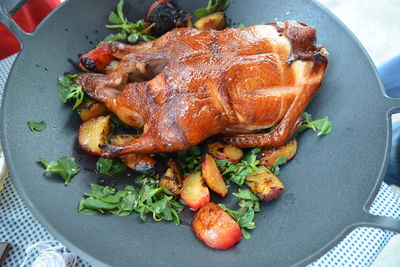 High angle view of roasted/grilled duck in wok dish