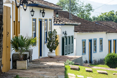 Exterior of house amidst trees and building