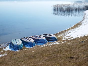 High angle view of shore against sky during winter