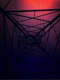 Low angle view of electricity pylon against sky