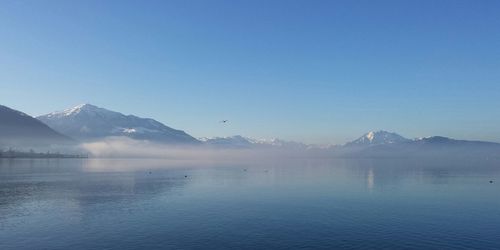 Scenic view of lake with mountains in background