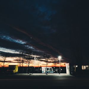 Illuminated built structure against sky at night