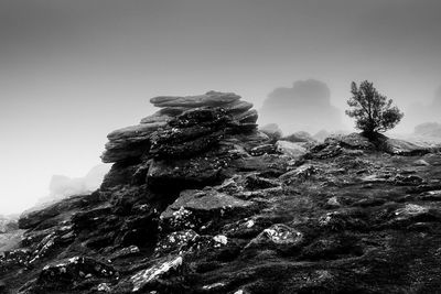 Low angle view of rock formation against clear sky