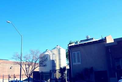 Low angle view of building against clear blue sky