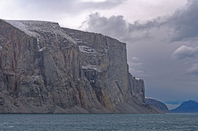 High cliffs guarding the fjord in the sam ford fjord on baffin island in nunavut, canada