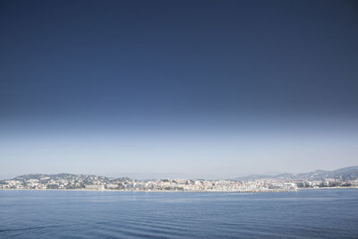 Scenic view of sea against clear sky during winter