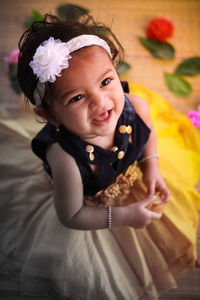 Close-up portrait of cute girl at home