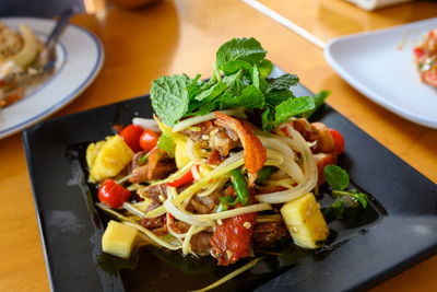 Close-up of salad served on table