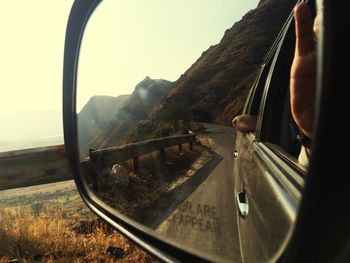 Cropped image of car on road