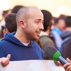 Man speaking on mic during protest