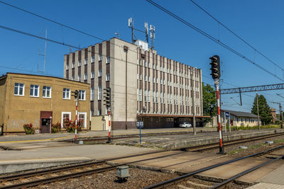 Railroad station platform against clear sky, train station in elblag, poland.