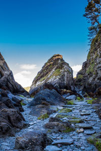 Scenic view of mountain against blue sky