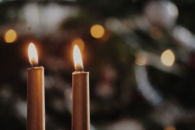 Close-up of candles burning in temple