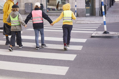 Children crossing road together