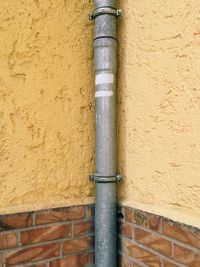 Close-up of pipe on wall