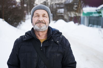 Portrait of man in snow