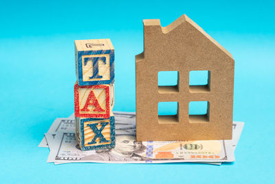 Close-up of information sign against blue background