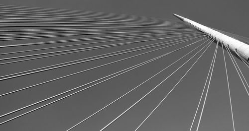 Low angle view of suspension bridge against sky