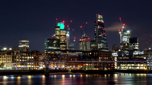 Illuminated city lit up at night