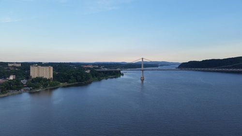 Scenic view of sea by city against clear sky