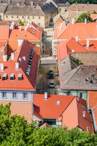 Roofs of houses, covered with old tiles with dilapidated chimneys.