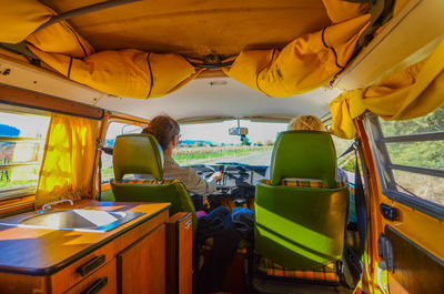 Young couple driving camper