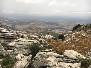 Scenic view of landscape against cloudy sky