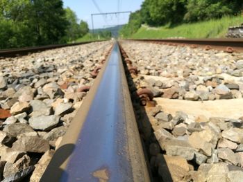 Surface level of railroad track against sky