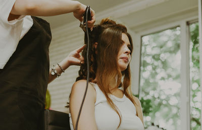 Portrait of a young girl at the hairdresser.