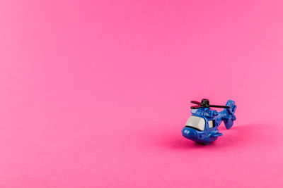 High angle view of toy car on pink background