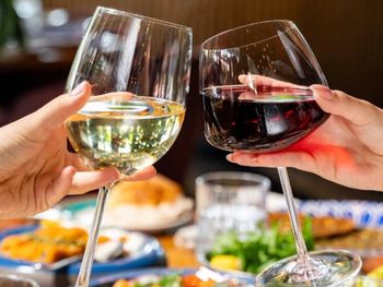 Close-up of hand holding wineglass