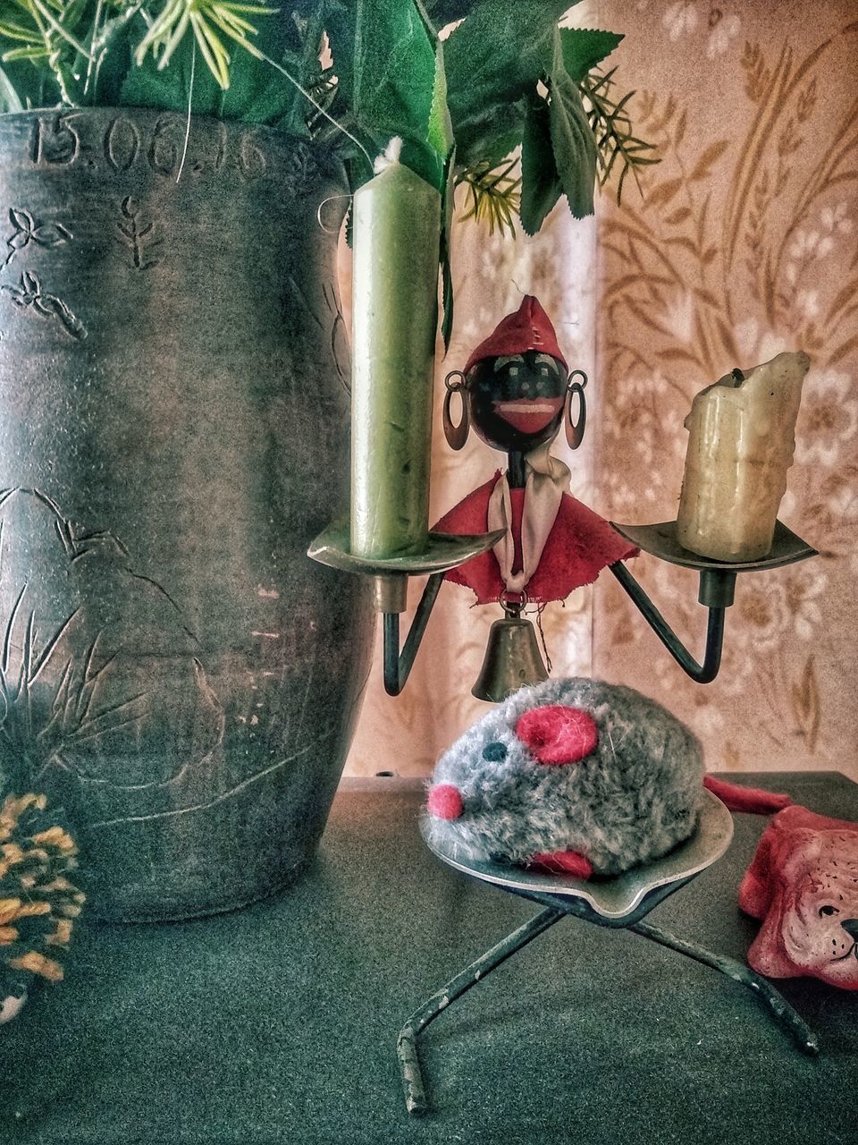 CLOSE-UP PORTRAIT OF FIGURINE WITH KNIFE ON TABLE