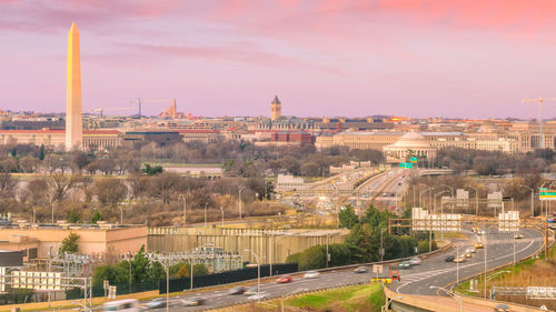 High angle view of buildings against sky at sunset