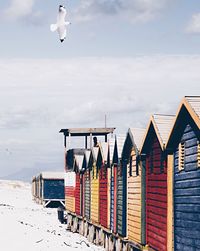 Lifeguard hut on beach against sky