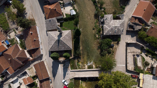 High angle view of houses and trees in town