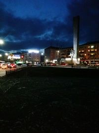 Illuminated cityscape against sky at night