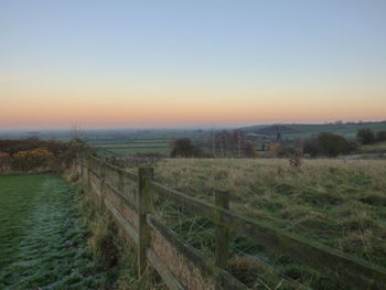 Scenic view of field against clear sky