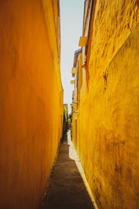 Narrow alley along buildings