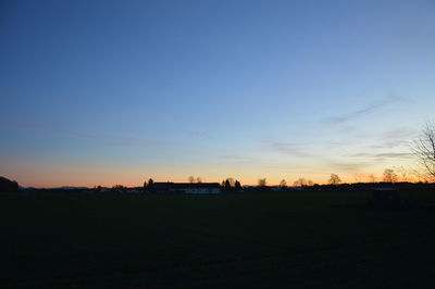 Silhouette landscape against sky during sunset