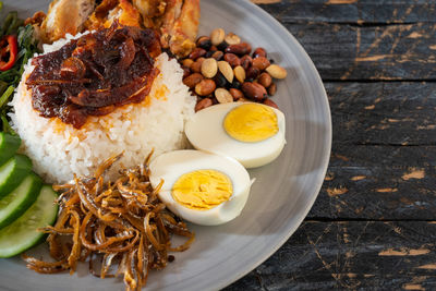 Nasi lemak is a malay fragrant rice dish cooked in coconut milk and pandan leaf.